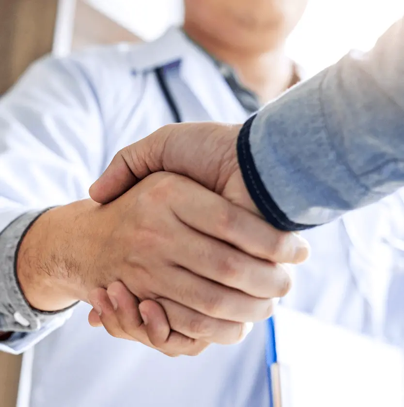 Close up of deal making handshake